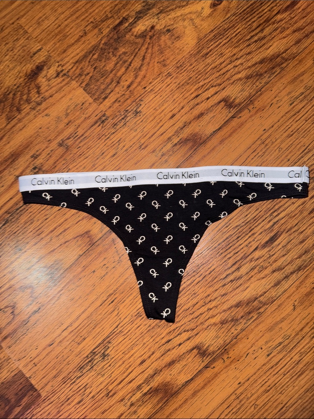 Calvin Klein Black Thong with White Logo Waistband